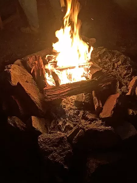 CAVEMAN TV: No men’s gathering would be complete without a campfire. - PHOTO BY GLEN STARKEY
