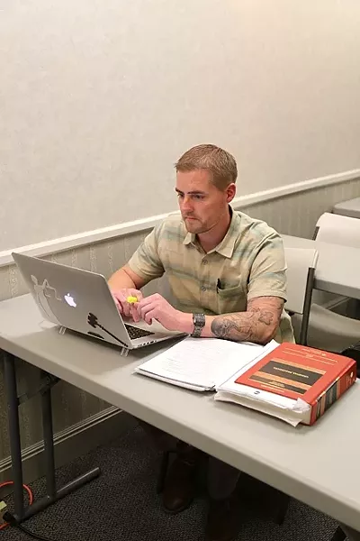 STUDIOUSLY: Ben Jacobson reviews course materials for a class on criminal procedure at the SLO College of Law, which opened its doors last summer. - PHOTO BY DYLAN HONEA-BAUMANN