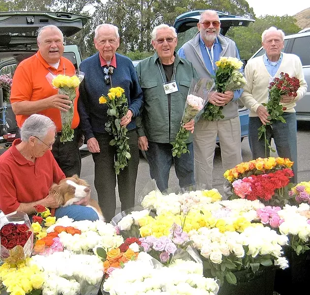 WEEKLY RITUAL: The Flower Power team members are (from left to right) Norm Mayer, Steve Bennett, Bob Wiese, Eugene Juel, Doug Schuur, and Leo Dumouchelle (absent member: Will Perry). Every Wednesday, Bennett picks up 1,400 surplus flowers from growers in Nipomo who donate them, which the men distribute to 25 assisted living or hospice centers in SLO County. - PHOTO COURTESY OF STEVE BENNETT