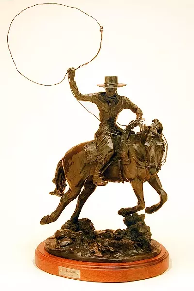 LASSO ’EM UP: In the bronze piece Buckaroo, Pat Roberts captures the movement of a cowboy riding his horse and trying to lasso up a cow. - PHOTO COURTESY OF PAT ROBERTS