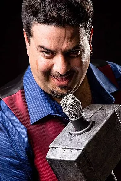 WELCOME TO THE SHOW: SLO Tease Burlesque’s founder Rick Castello serves as the master of ceremonies at the group’s semiannual shows. - PHOTO COURTESY OF BRIAN J. MATIS PHOTOGRAPHY