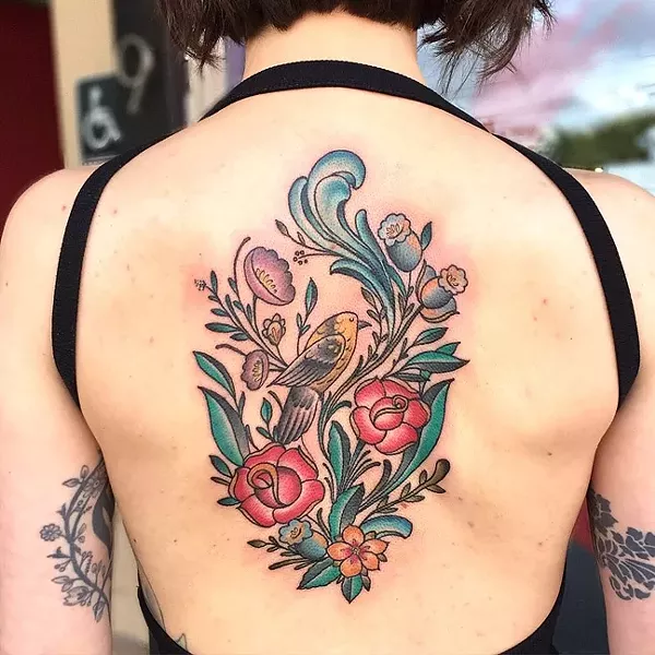 HIDDEN BEAUTY : The upper back is also a popular spot for tattoos, like this floral design by Jake Schroeder. - PHOTO COURTESY OF JAKE SCHROEDER