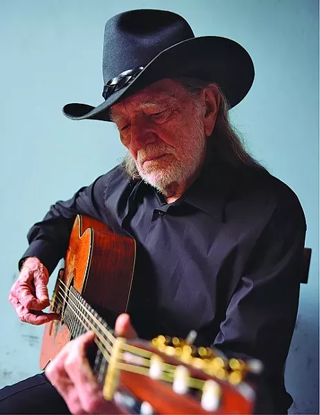 WILLIE & TRIGGER: Country superstar Willie Nelson and his beloved Martin guitar, Trigger, appear at the Avila Beach Resort on Oct. 21. - PHOTO COURTESY OF WILLIE NELSON