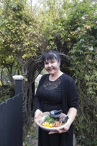 WITCHY WOMAN: Power, spirituality, feminism—life and death: all of these grand dealings can be coaxed out of the many herbs catalogued at Kathryn Clayton’s Cambria shop, Spellbound. - PHOTO BY JAYSON MELLOM