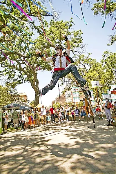 DAY OF WONDER: A stilt walker leaps in the air at the downtown park in Paso Robles as part of Paso ArtsFest last year. - PHOTO COURTESY OF ALLYSON MAGDA
