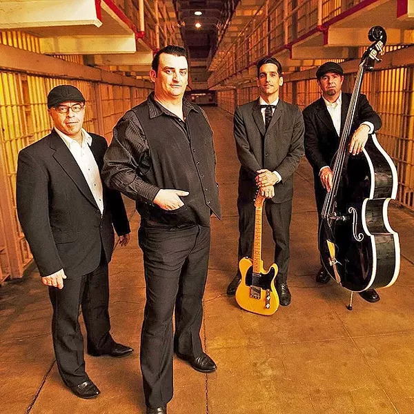 PRISON BLUES: Johnny Cash tribute act Cash’d Out, here posing at Alcatraz, brings the vibe of Cash’s Folsom Prison and San Quentin live albums to their show at Tooth & Nail on May 14. - PHOTO COURTESY OF CASH’D OUT