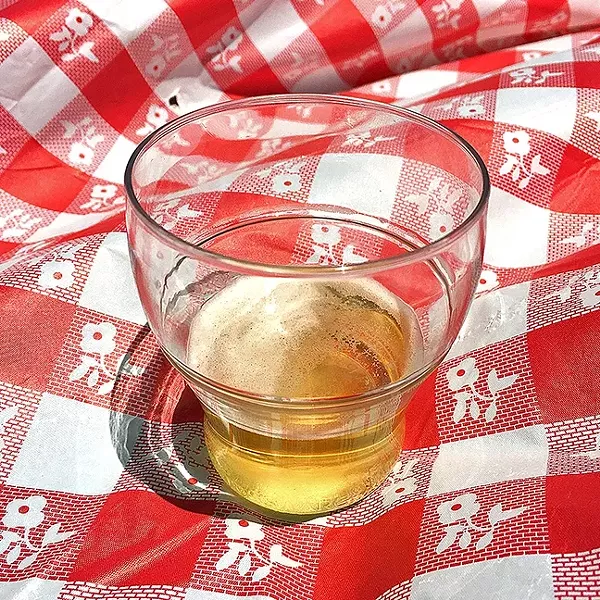TWO OUNCES TO FREEDOM: Beer was dispensed about 2 ounces at a time, leading to frequent refills. - PHOTO BY GLEN STARKEY