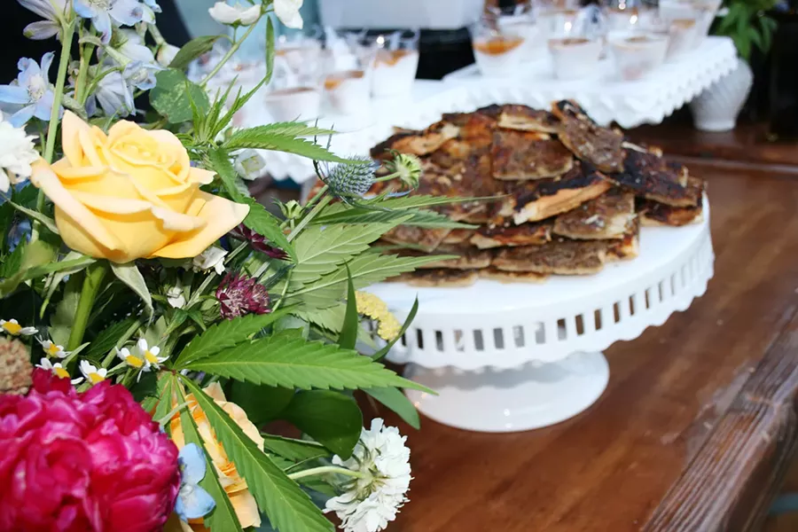 INFUSED FEAST Baywood-based Good Tides Organic Bistro Owner Alyx Gille serves up TCH and CBD infused treats at the Central Coast's first Cannabis Wedding Event hosted on June 27 in SLO. - PHOTO BY HAYLEY THOMAS CAIN