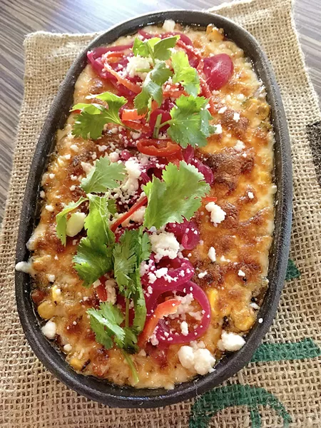 SHARING IS CARING The Vegetable Butcher's Queso Fundido is perfect for sharing with friends over a glass of wine or craft beer. - PHOTO BY REID CAIN