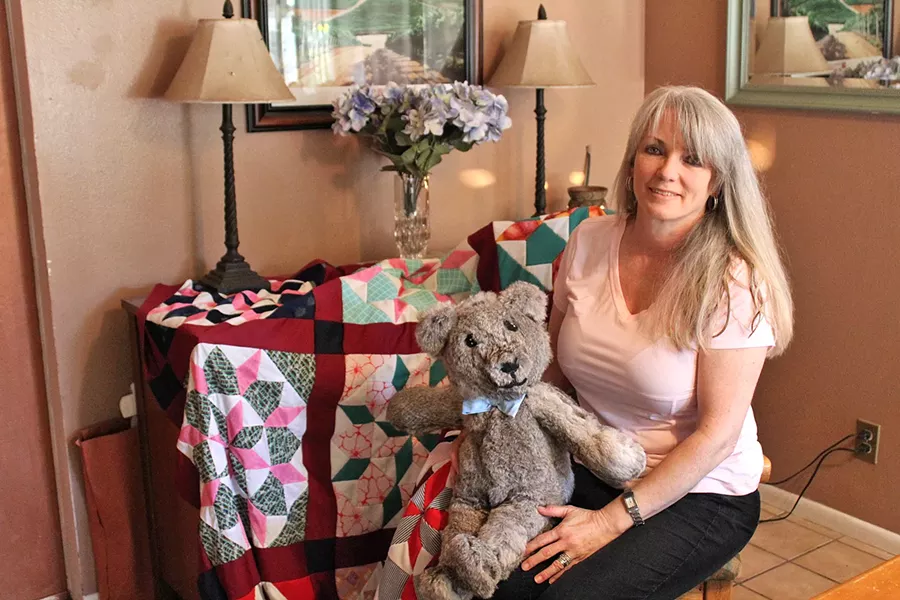 MEMORIES IN THE STITCH Lily Stitches Owner Lisa Adam created a quilt made with patches of her late grandmother’s work and a bear made from a fur coat given to her by her late father. - PHOTO BY CARMEN AGUILA-TORNERO