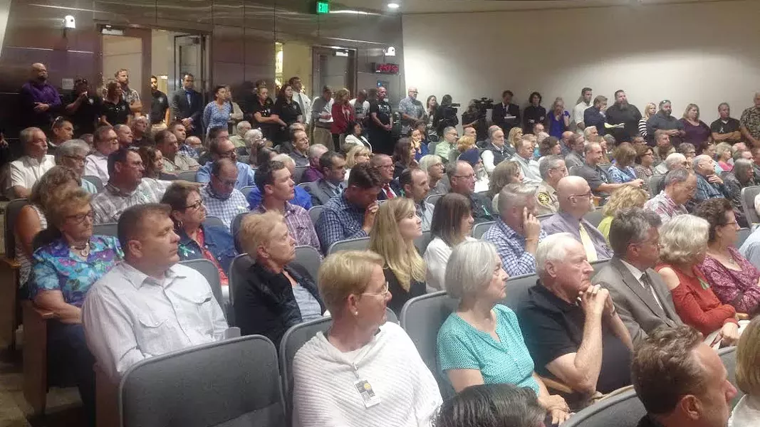 FULL HOUSE Supporters of SLO County Sheriff Ian Parkinson and family and friends of Andrew Holland packed a Board of Supervisors meeting to address issues of health and safety at the SLO County Jail Aug. 22. - PHOTO BY CHRIS MCGUINNESS