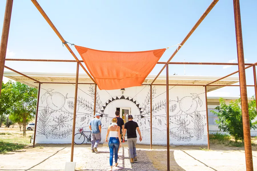 REACHING THE SUMMIT In May, the Blue Sky Center in Cuyama hosted the two-day Rural Summit, during which artists, students, government officials, nonprofits, and community members shared meals and gathered momentum for making positive changes in the town. - PHOTO BY JAYSON MELLOM