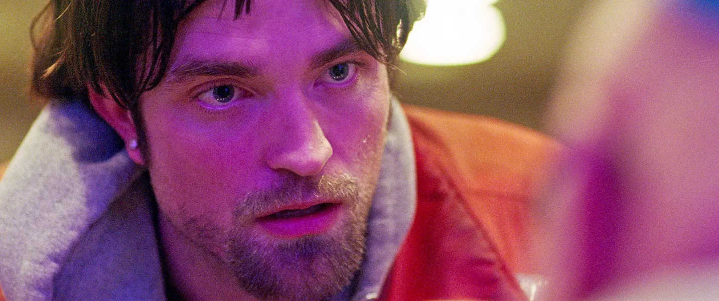 RACE AGAINST TIME Bank robber Connie Nikas (Robert Pattinson) must raise $10,000 to get his brother out of Rikers Island before he's killed. - PHOTO COURTESY OF ELARA PICTURES