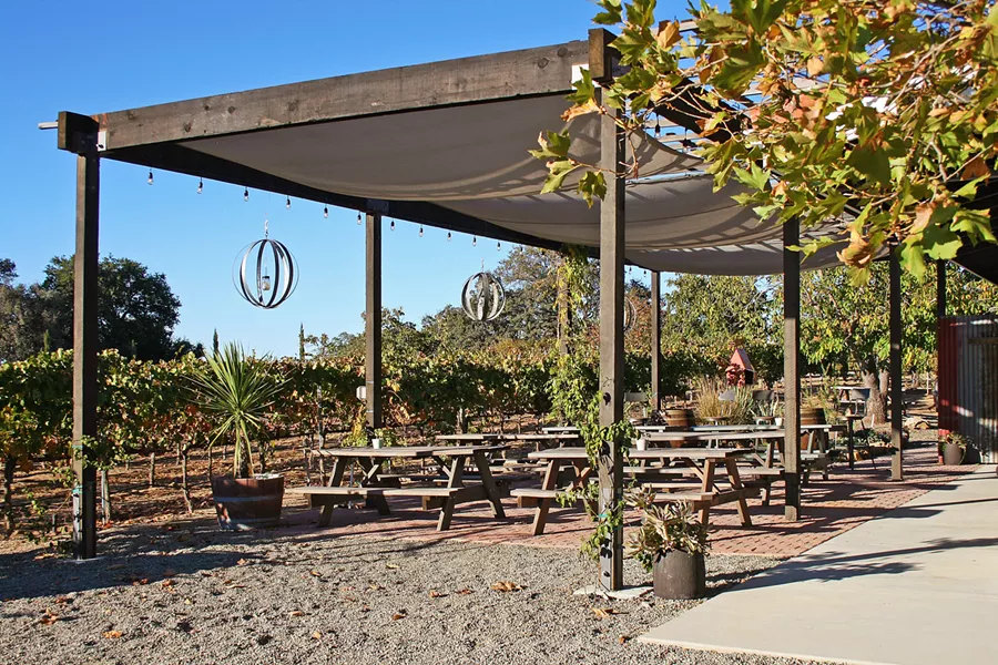 COME HANG Lone Madrone's seating area is where Sunday burger nights unfold each spring and summer. - PHOTO BY HAYLEY THOMAS CAIN
