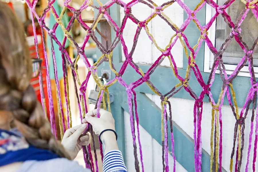 A LONG YARN A YouTube video can walk you through the technique it takes to turn knots into a wall-hanging. - PHOTO BY JAYSON MELLOM