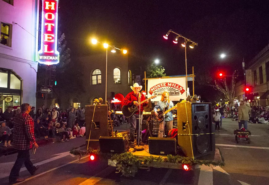 COWBOY UP! Local country music hero Monte Mills pumps up the crowd during the 42nd annual Holiday Parade. The theme this year was Holiday Hoedown. - PHOTO BY JAYSON MELLOM