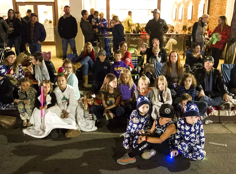 RAPT AUDIENCE Kids especially marveled at this year's parade lining the entire nine-block parade route. - PHOTO BY JAYSON MELLOM