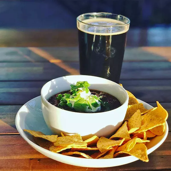 LOCAL SNACK ATTACK Spicy three bean chili served hot at 7Sisters Brewing Company satisfies on chilly January nights. You'll also want to try their extensive grilled cheese selection, which ranges from a simple kids version to one featuring ciabatta and pancetta. As always, all ingredients are sourced locally from in and around SLO County. - PHOTO COURTESY OF 7SISTERS BREWING CO.
