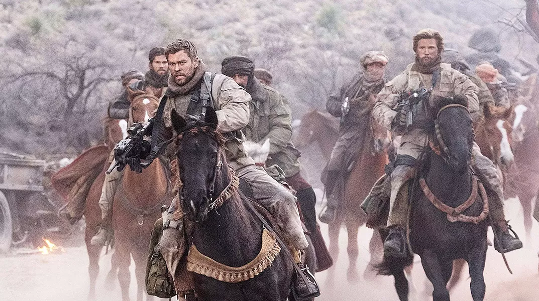 HORSE SOLDIERS In the aftermath of 9/11, Capt. Mitch Nelson (Chris Hemsworth) leads a U.S. Special Forces team into Afghanistan on a dangerous mission in 12 Strong. - PHOTO COURTESY OF WARNER BROS. PICTURES