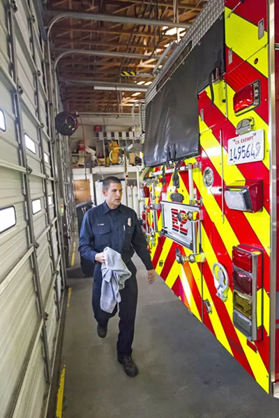 SIDE HUSTLES When Jeff Lane isn't working for the fire department he picks up professional photography and construction jobs to make money. - PHOTO BY JAYSON MELLOM