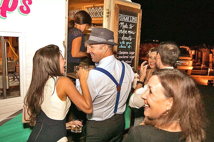 FRESH FROM THE OVEN Sugar Lips Mini Donuts parks its trailer at wedding venues throughout the county to serve up freshly made doughnuts with a variety of toppings. - PHOTO COURTESY OF JESSICA BROWN