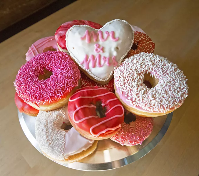 MATCHING COLORS SLO Donut Company in San Luis Obispo serves multiple weddings a week now. They can custom design doughnuts to a theme or to match the colors of bridesmaids' dresses. - PHOTO BY JAYSON MELLOM