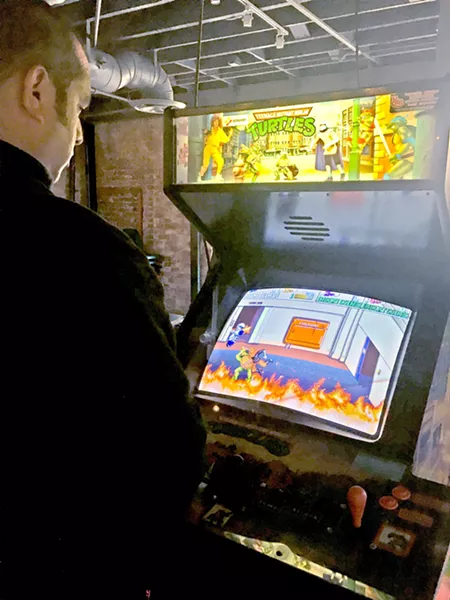 SIBLING ADVENTURES Every time I come home, my brother and I find a new place to explore, like this building that had a second floor filled with vintage games. - PHOTO BY KAREN GARCIA