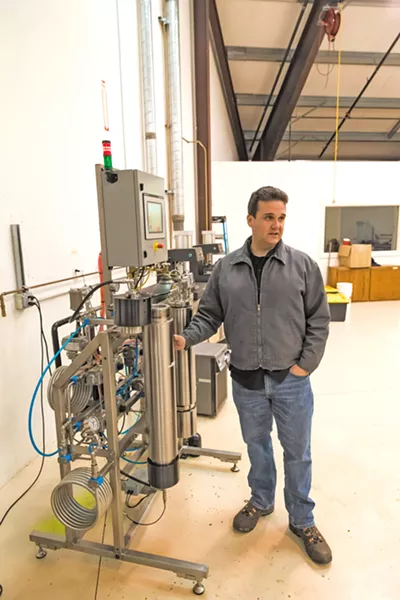 EXTRACTING CANNABIS OIL Cannabis entrepreneur Jason Kallen stands next to his carbon-dioxide extractor machine at a warehouse off Tank Farm Road. - PHOTO BY JAYSON MELLOM