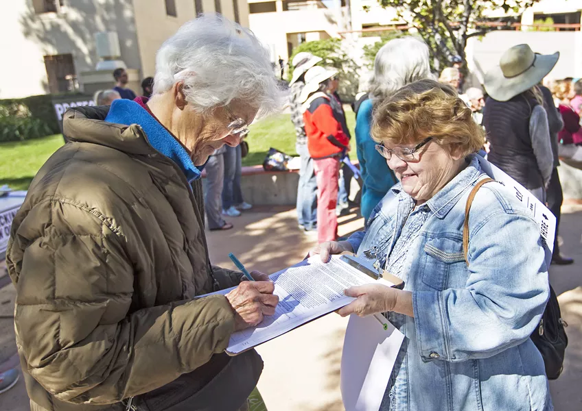 GET OIL OUT Petitioners kicked off a ballot initiative in February to ban new oil wells, hydraulic fracturing, and other intense oil extraction techniques. On May 1, activists delivered 20,000 signatures to the county. - FILE PHOTO BY JAYSON MELLOM