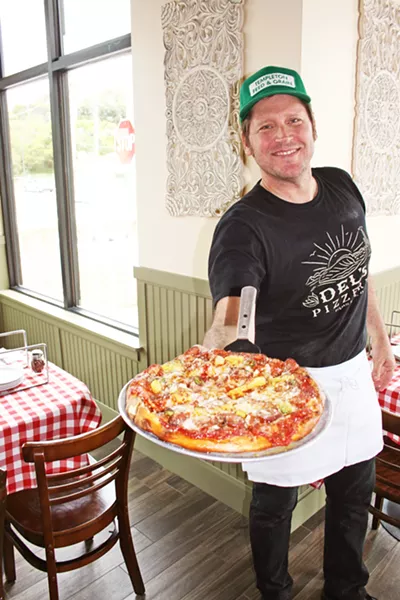 SINCE 1973 Ryan Delmore of Del's Pizzeria and his brother Darren grew up in the pizza business and have yet to change their popular family recipes. Now, 45 years after first opening, the family invites folks to check out a brand new location at 1101 Price St., suite 100. - PHOTO BY HAYLEY THOMAS CAIN