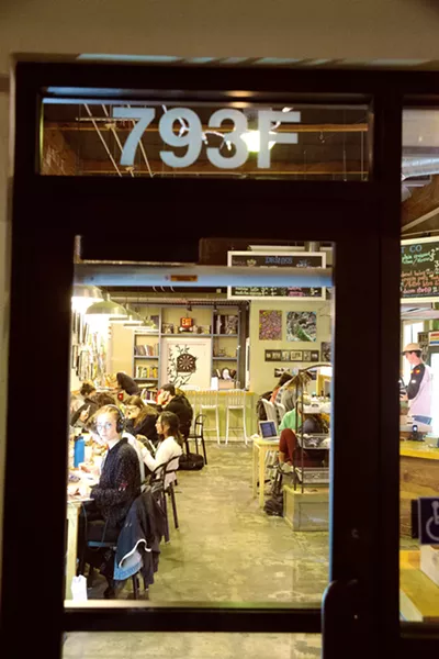 STUDY BUDDIES Sure it's 3:30 a.m. at SloDoCo, but Cal Poly students are still at it. The studying never stops when the fried bacon-glazed doughnuts are available 24/7. - PHOTO BY JAYSON MELLOM