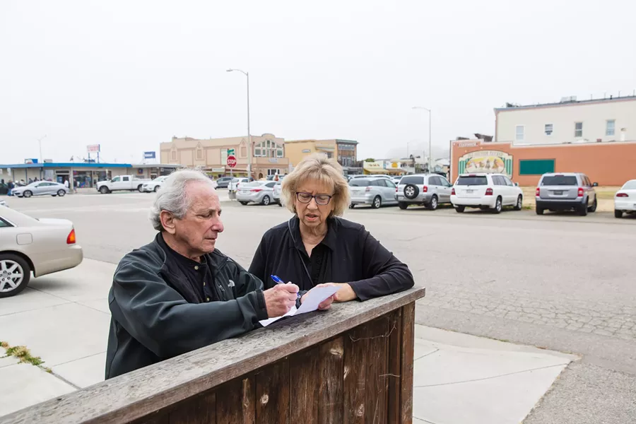 GETTING TO WORK Cayucos Advisory Council members John Carsel and Cheryl Conway are seeking tighter regulations on vacation rentals in Cayucos. The small beach town has the most vacation rental licenses per capita in SLO County. - PHOTO BY JAYSON MELLOM