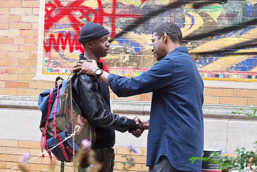 MENTOR When he's not driving a Lyft or righting wrongs, McCall (Washington) guides neighbor kid Miles (Ashton Sanders) away from gang life. - PHOTO COURTESY OF FAQUA FILMS