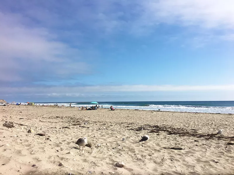 SOAKING UP SUMMER While the parking and camping sites were bustling with people, the actual beach had so much open space that it wasn't crowded at all. - PHOTO BY KAREN GARCIA