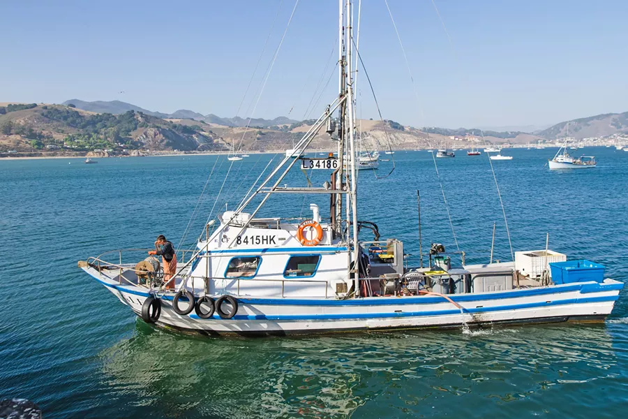 CATCH OF THE DAY Crab and salmon boat Eagle arrives in Port San Luis with a load of rock crab and conch. - PHOTO BY JAYSON MELLOM