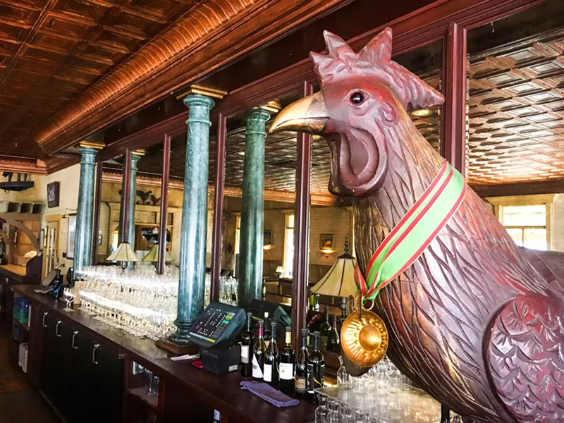 SUNDAY DINING A rooster and an empty restaurant greet attendees of a special brunch on Oct. 14 at McPhee's Grill, who head to the back room for food, drink, and a history lesson. - PHOTO BY CAMILLIA LANHAM