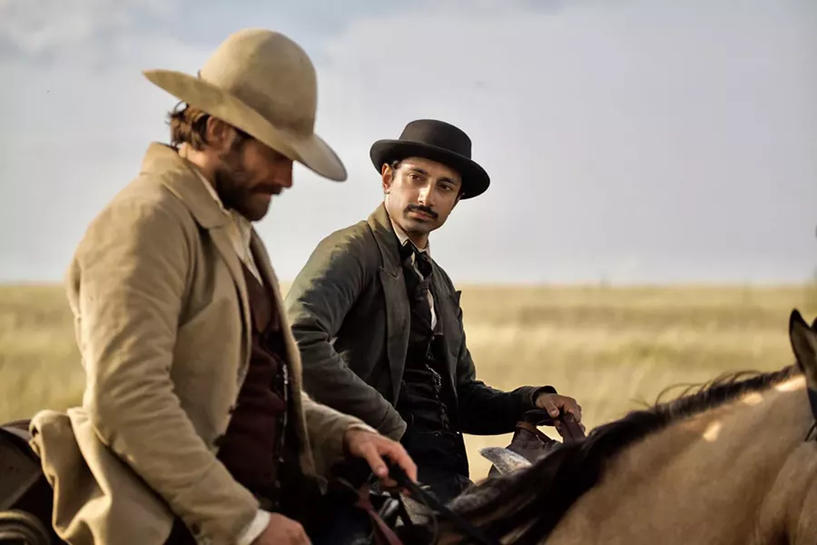 ON THE RUN Scout John Morris (Jake Gyllenhaal, left) takes chemist and budding prospector Hermann Kermit Warn (Riz Ahmed) under his wing, putting them both in the Sisters brothers' crosshairs. - PHOTO COURTESY OF ANNAPURNA PICTURES