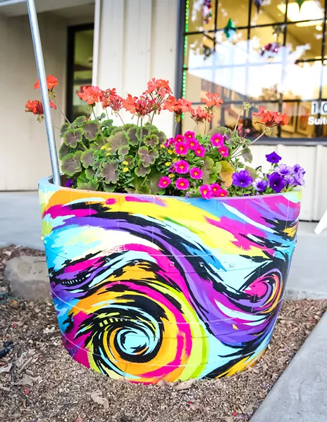 COMMUNITY ART The colorful wine barrel flower planter in front of the Laure Carlisle Art Studio & Gallery is one of about 100 planters decorated by local artists that will adorn the downtown Paso Robles area. - PHOTO BY JAYSON MELLOM