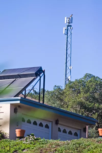NEW NETWORK A 50-foot antenna stands behind Tom Kosta's house in Arroyo Grande. In 2014, it just served his property with high-speed internet. Today, it's the foundation for Peak WiFi, a wireless network with more than 1,000 connections. - PHOTOS BY JAYSON MELLOM