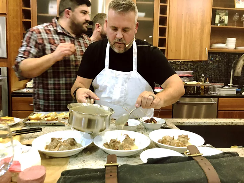 KRUSH VS THE JUG The clock ticked down as The Krush 92.5's Cork Dorks (Adam Montiel and Jeremy West) battled 98.1 KJUG's Tom and Becky in the Morning (Tom Keffury and Becky Kingman) during a cooking competition held earlier this month at Idler's Home Paso Robles. The good-natured battle featured recipes and guidance from Chef Jacob Town of The Spoon Trade and Chef Jacob Lovejoy of love.joy.eat Private Catering. Pictured: Radio personality Jeremy West of Krush 92.5 plates meatballs with local chanterelle mushroom gravy while his Cork Dorks cohost, Adam Montiel, races against the clock. - PHOTOS BY HAYLEY THOMAS CAIN