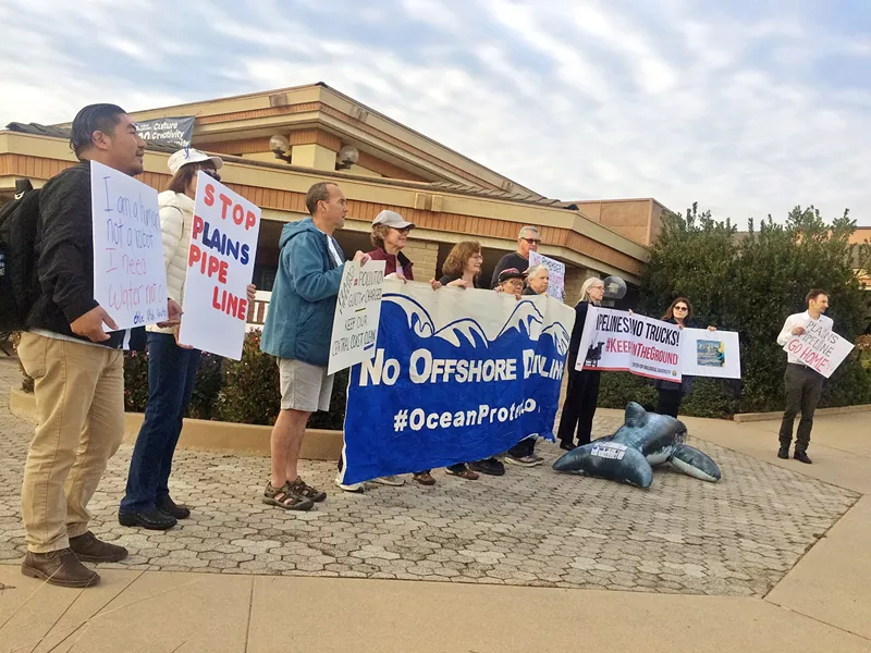 TAKING SIDES Supporters and opponents of a proposed 123-mile oil pipeline replacement project gathered at two hearings in SLO and Santa Barbara counties. - PHOTO BY CHRIS MCGUINNESS
