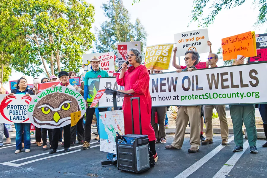 RESISTANCE SLO Mayor Heidi Harmon (center) leads a rally on May 22 against a federal plan to increase oil and gas production on public lands in Central California. - PHOTO BY JAYSON MELLOM