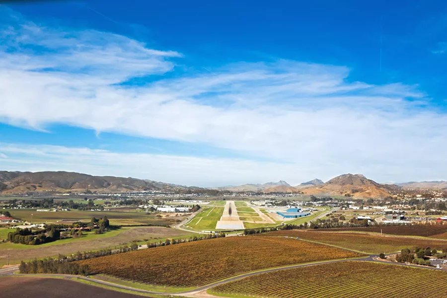 OFF COURSE While taking a morning ride next to the SLO Airport, Ross Pepper claims he was knocked off his bike by a passing plane. He's suing the airport. - FILE PHOTO BY KAORI FUNAHASHI