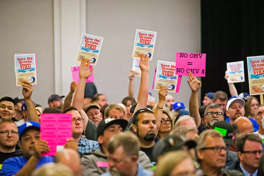 DULY NOTED Hundreds of people from across the state attended a California Coastal Commission meeting in San Luis Obispo on July 11, where commissioners considered a staff recommendation to limit off-highway vehicle riding in the Oceano Dunes State Vehicular Recreation Area. - PHOTO BY JAYSON MELLOM