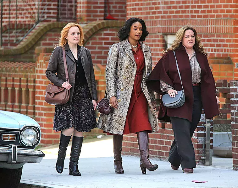 TAKE CHARGE In 1970s New York, three gangsters' wives—(left to right) Claire (Elizabeth Moss), Ruby (Tiffany Haddish), and Kathy (Melissa McCarthy)—decide to continue running their Hell's Kitchen rackets after the men are imprisoned, in The Kitchen. - PHOTO COURTESY OF BRON STUDIOS