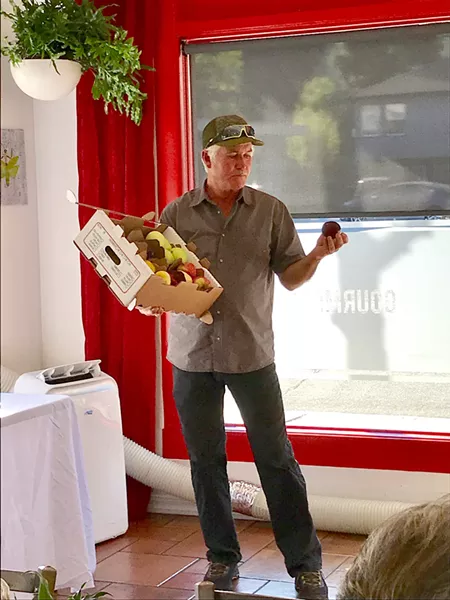 APPLE APOSTLE A tireless worker, Mike Cirone personally sells every apple, nectarine, peach, and pear he grows. Before the Aug. 12 apple lecture at SLO Provisions, he had just returned from a long day at the Baywood Park Farmers' Market in Los Osos. - PHOTOS BY BETH GIUFFRE