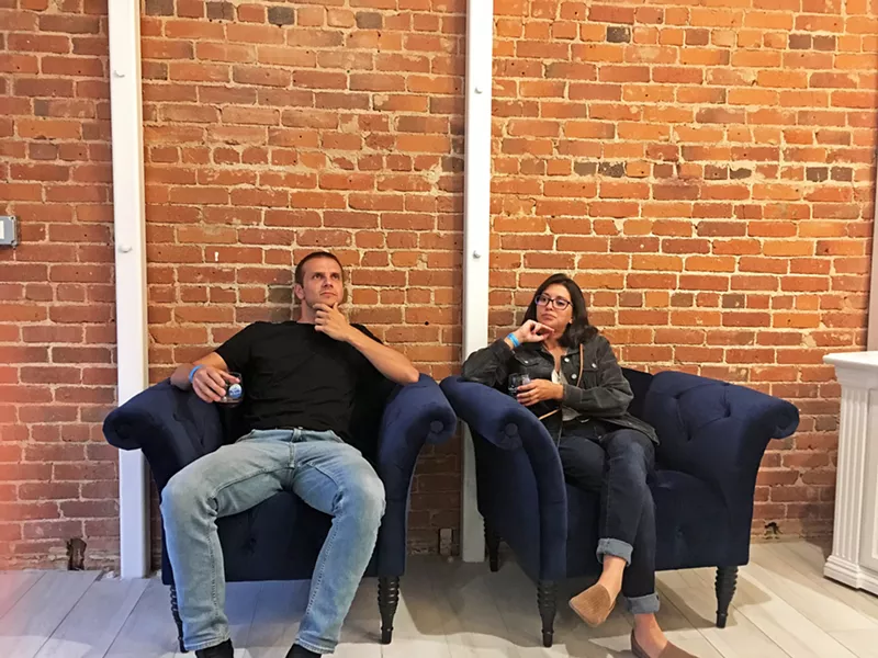 PIT STOP There was a lot of walking involved in the event, so Assistant Editor Peter Johnson (left) and I chose these fancy chairs at Sheila Kearns Chocolate & Confections to take a quick break. - PHOTO BY KASEY BUBNASH