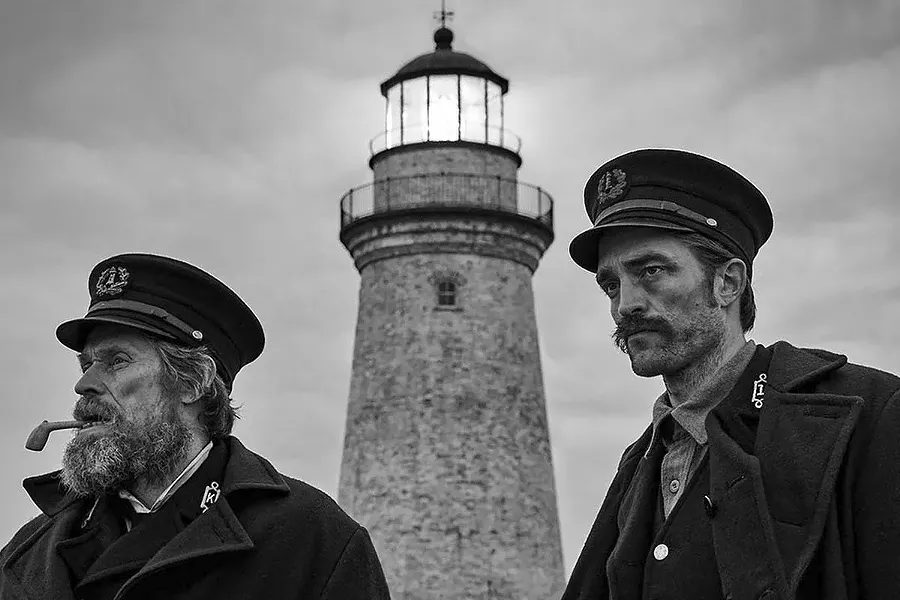 MAD WORLD Two men—Thomas Wake (Willem Dafoe, left) and Ephraim Winslow (Robert Pattinson)—find themselves trapped on a remote island together in the hallucinatory black and white horror fantasy, The Lighthouse, screening exclusively at The Palm Theatre. - PHOTO COURTESY OF A24