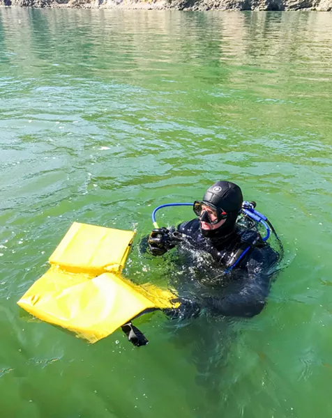 PRACTICE DIVE San Luis Obispo County Sheriff's Deputy Matt Holten prepares for a practice recovery as part of an Oct. 12 training for the Sheriff's dive team in Port San Luis. Holten was one of 15 dive team members dispatched to the Channel Islands Conception disaster last month. - PHOTO BY JAYSON MELLOM