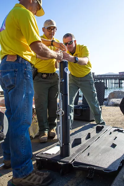 SONAR SLO Sheriff's dive team members assemble a side-scan sonar device to use in a training at Port San Luis on Oct. 12. - PHOTO BY JAYSON MELLOM